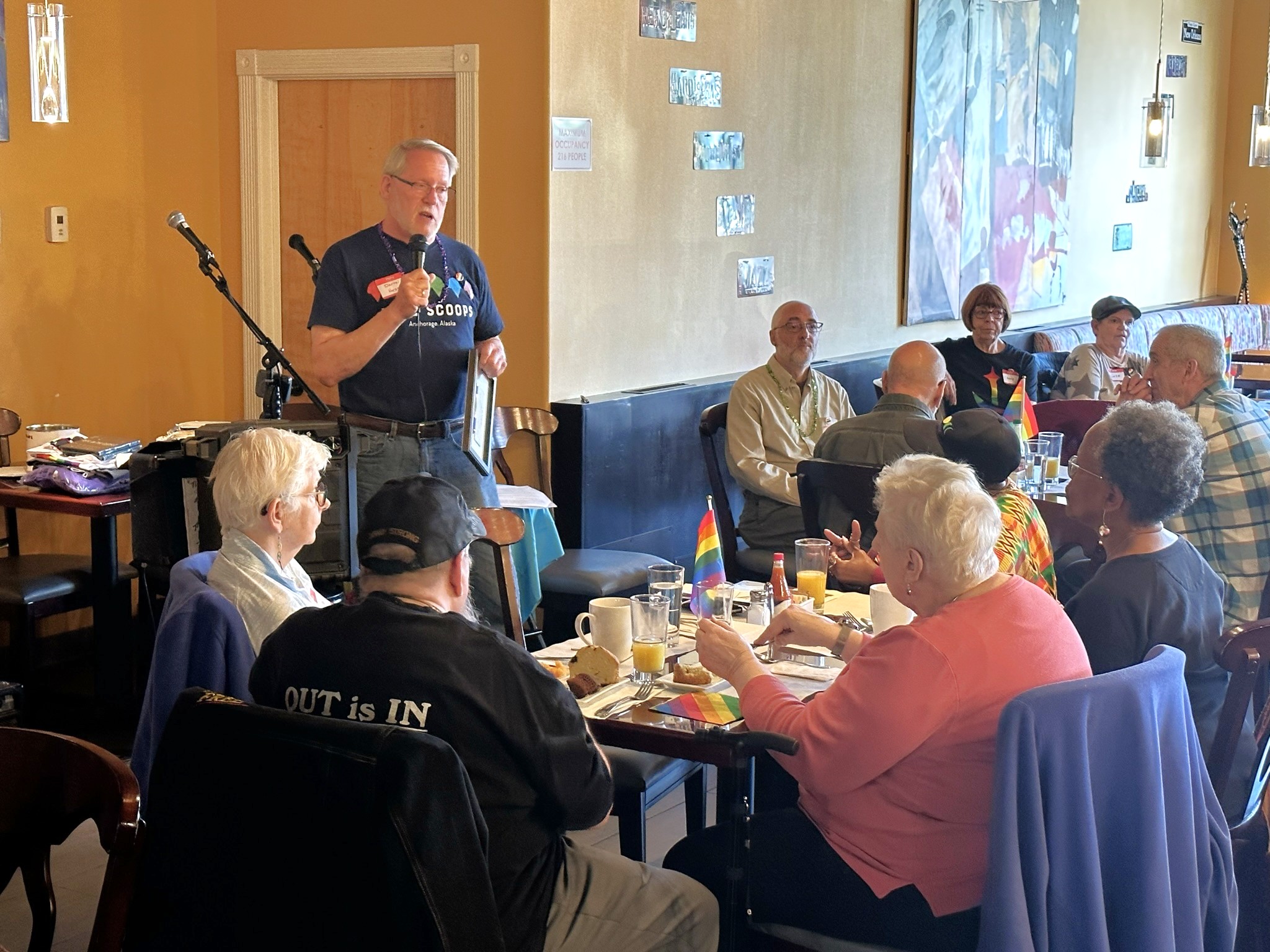Image of Darrel Hess speaking to the community in Anchorage